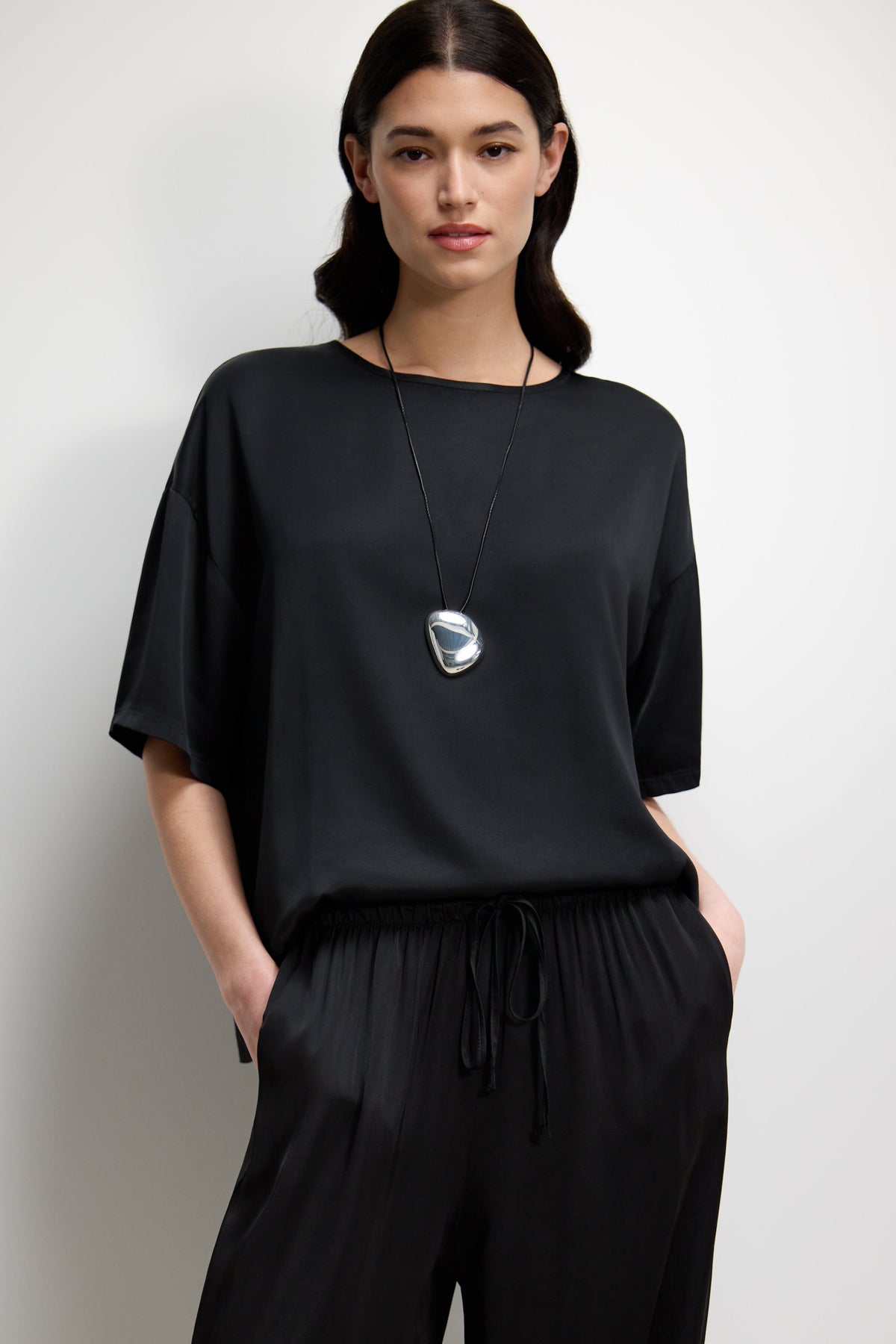 Women's Black Satin Top with Back Slit Detail and Elegant Design