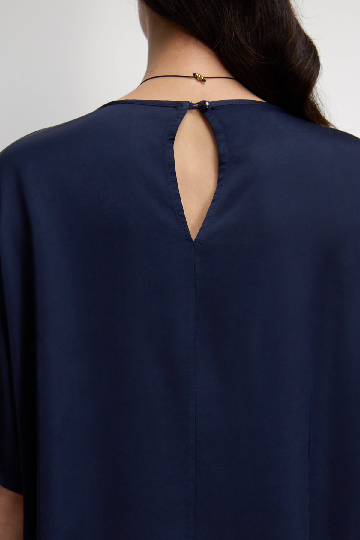 Women's Navy Satin Top with Back Slit Detail and Elegant Design